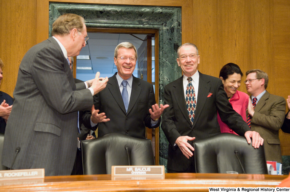 ["Photograph of Senator Max Baucus being greeted by Senators John D. (Jay) Rockefeller and Charles Grassley as he enters the Finance Committee hearing room."]%