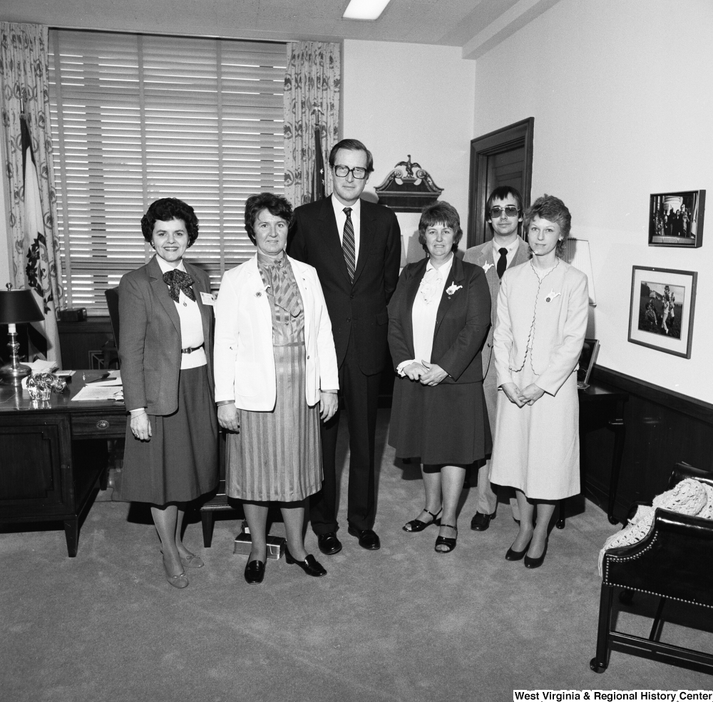 ["Senator John D. (Jay) Rockefeller poses for a photograph with an unidentified group in his Washington office."]%