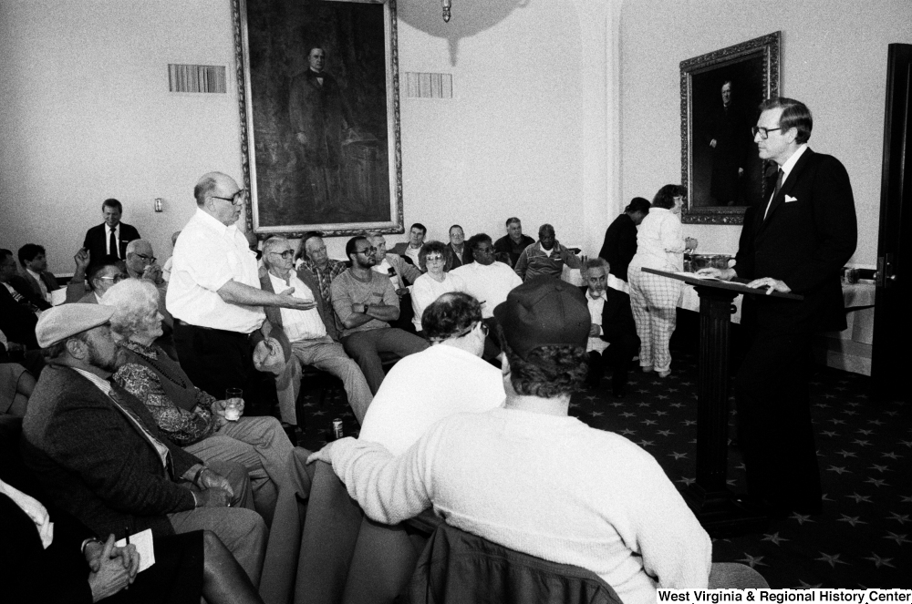 ["A man in the audience asks Senator John D. (Jay) Rockefeller a question after his speech about black lung disease."]%