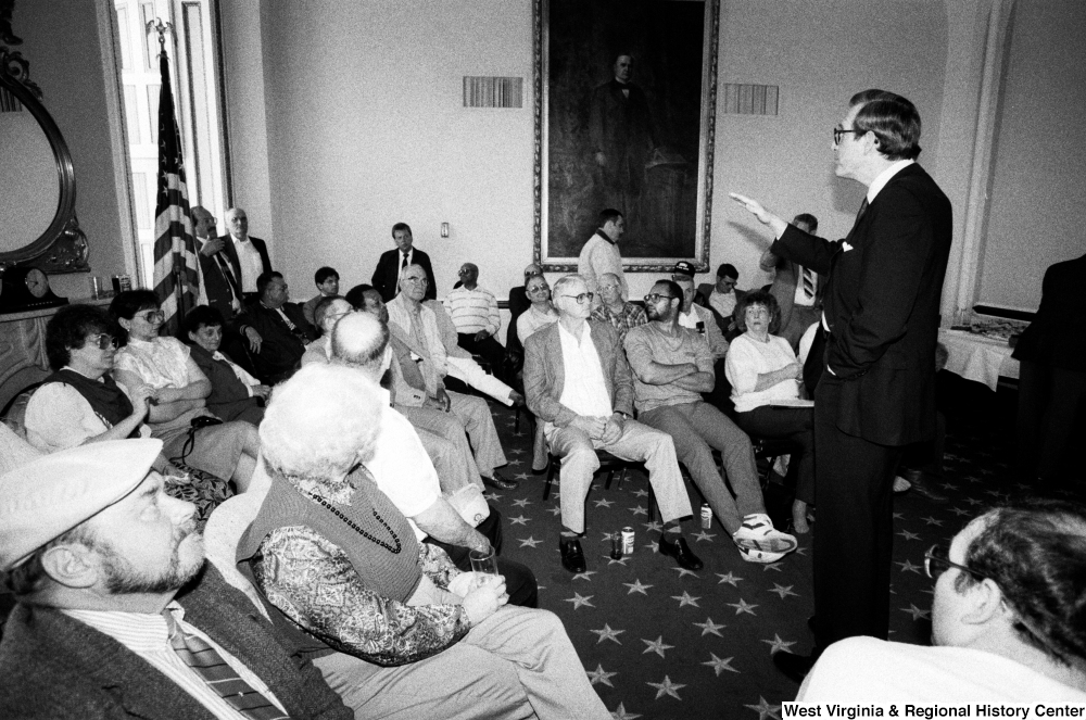 ["Senator John D. (Jay) Rockefeller answers questions during the discussion portion of a black lung event in the Senate."]%