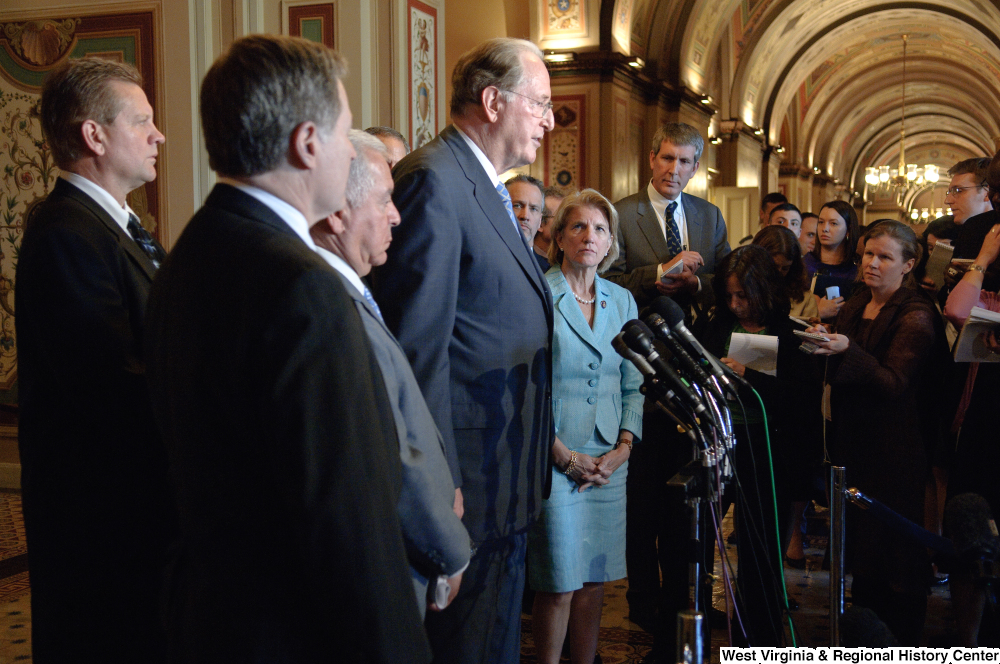 ["Senator John D. (Jay) Rockefeller speaks at a media event in a hallway outside the Senate."]%