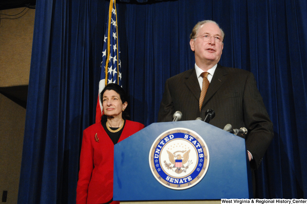 ["Standing beside Senator Olympia Snowe, Senator John D. (Jay) Rockefeller speaks at a Senate press event."]%