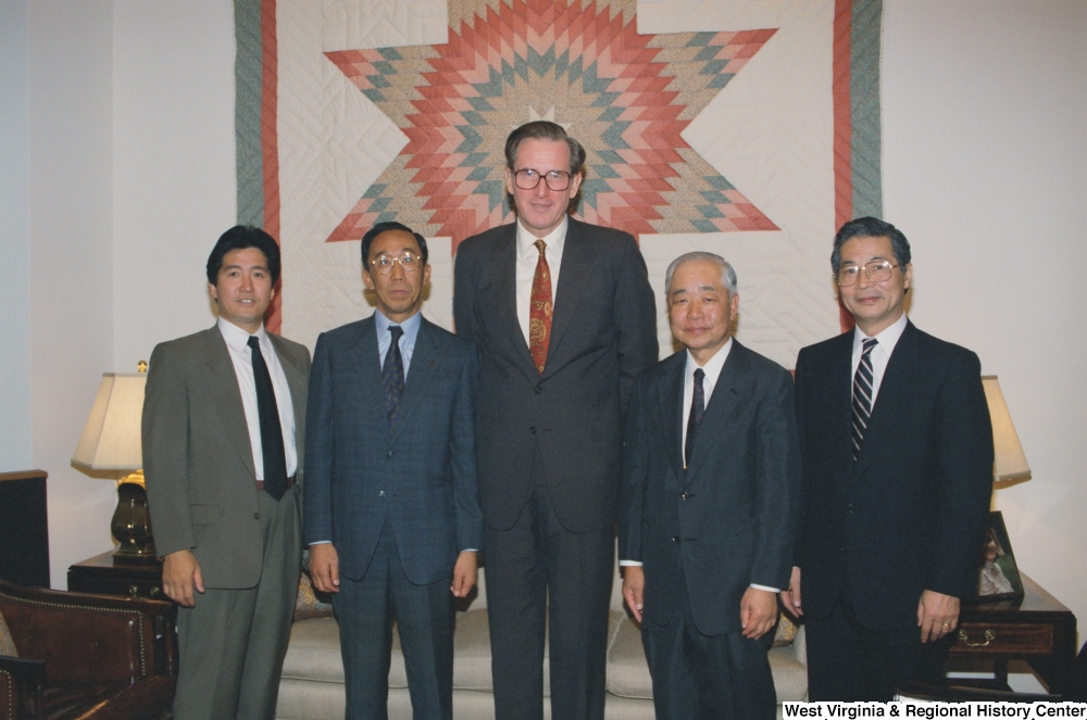 ["Senator John D. (Jay) Rockefeller stands with four men in his Washington office."]%