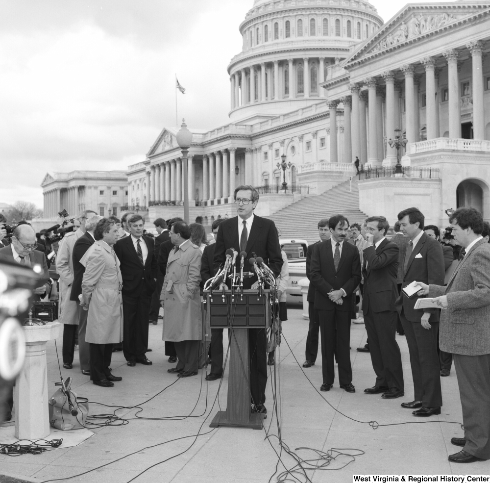 ["Senator John D. (Jay) Rockefeller addresses the media at an event outside the Senate building."]%