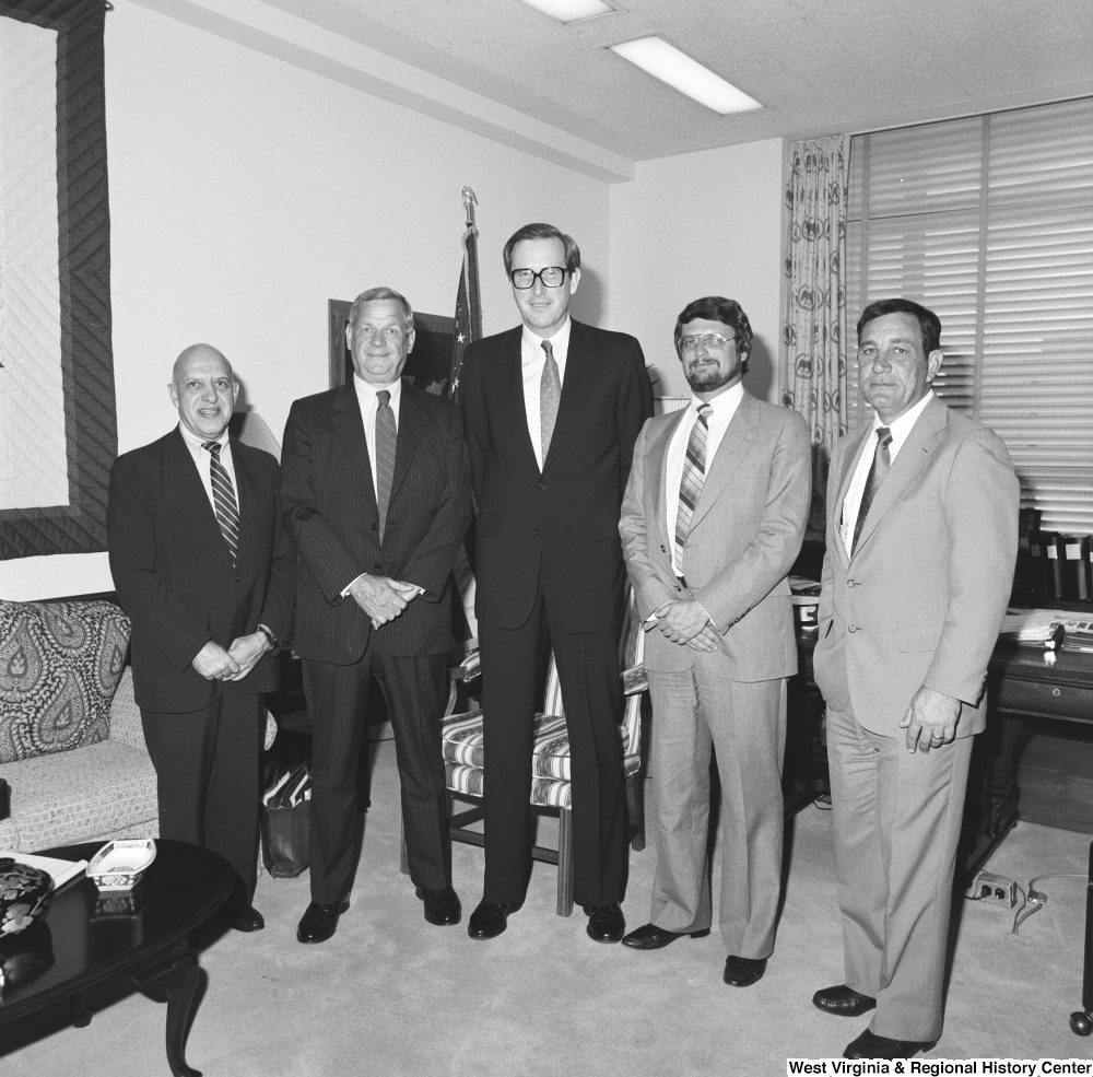 ["Senator John D. (Jay) Rockefeller stands for a photograph with a group of officials from Weirton Steel in his Washington office."]%