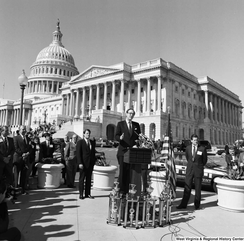 ["Senator John D. (Jay) Rockefeller speaks at a clean vehicle event outside the Senate."]%