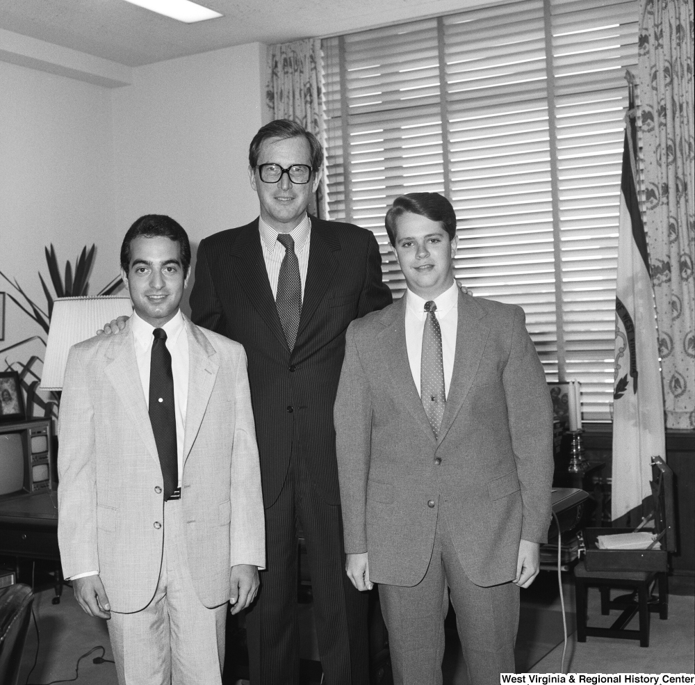 ["Senator John D. (Jay) Rockefeller stands for a photograph with two unidentified students in his Washington office."]%