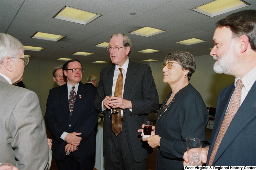 ["Senator John D. (Jay) Rockefeller speaks with unidentified individuals at a recognition ceremony hosted by the Federation of American Women's Clubs Overseas."]%