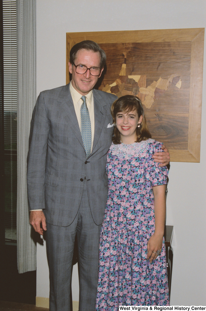 ["Senator John D. (Jay) Rockefeller stands beside one of his student interns."]%