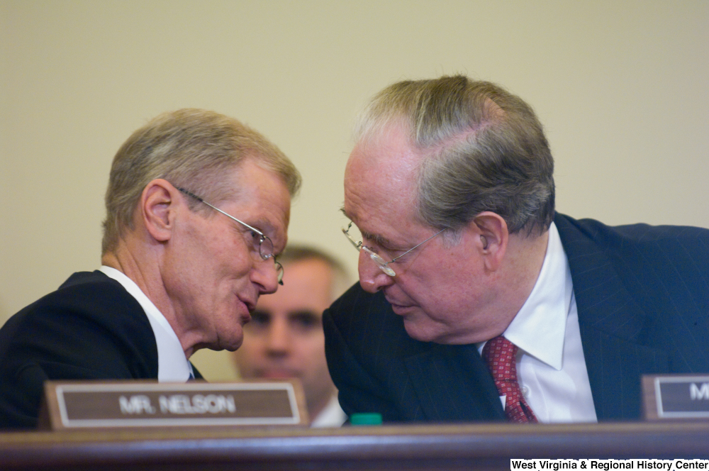 ["Senator John D. (Jay) Rockefeller and Senator Bill Nelson talk during a Commerce Committee hearing."]%