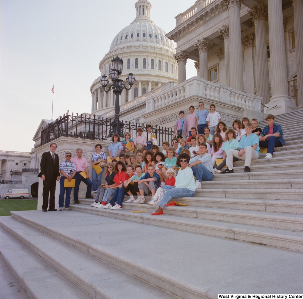 ["Senator John D. (Jay) Rockefeller stands next to a school group on the steps of the Senate."]%