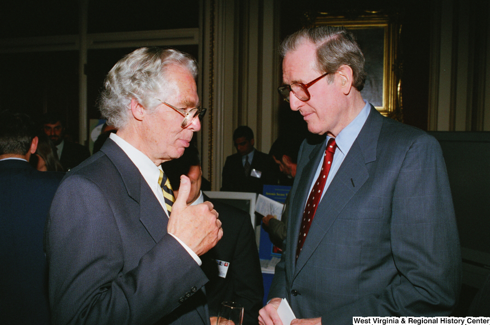 ["At the Celebrating Telemedicine event about healthcare technology, Senator John D. (Jay) Rockefeller speaks to one of the attendees."]%