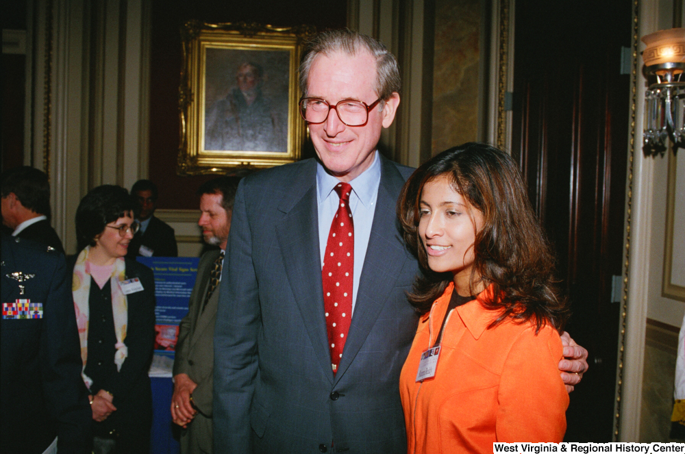 ["Senator John D. (Jay) Rockefeller poses for a photograph with a woman at the Celebrating Telemedicine conference."]%