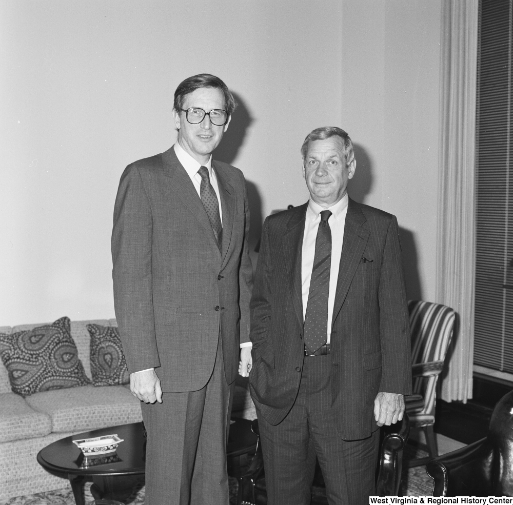 ["Senator John D. (Jay) Rockefeller stands with an unidentified man in his office."]%