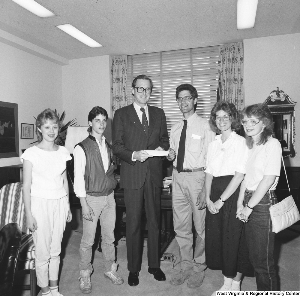 ["Senator John D. (Jay) Rockefeller stands for a photograph with a group of students from the Mountain State Academy in West Virginia."]%