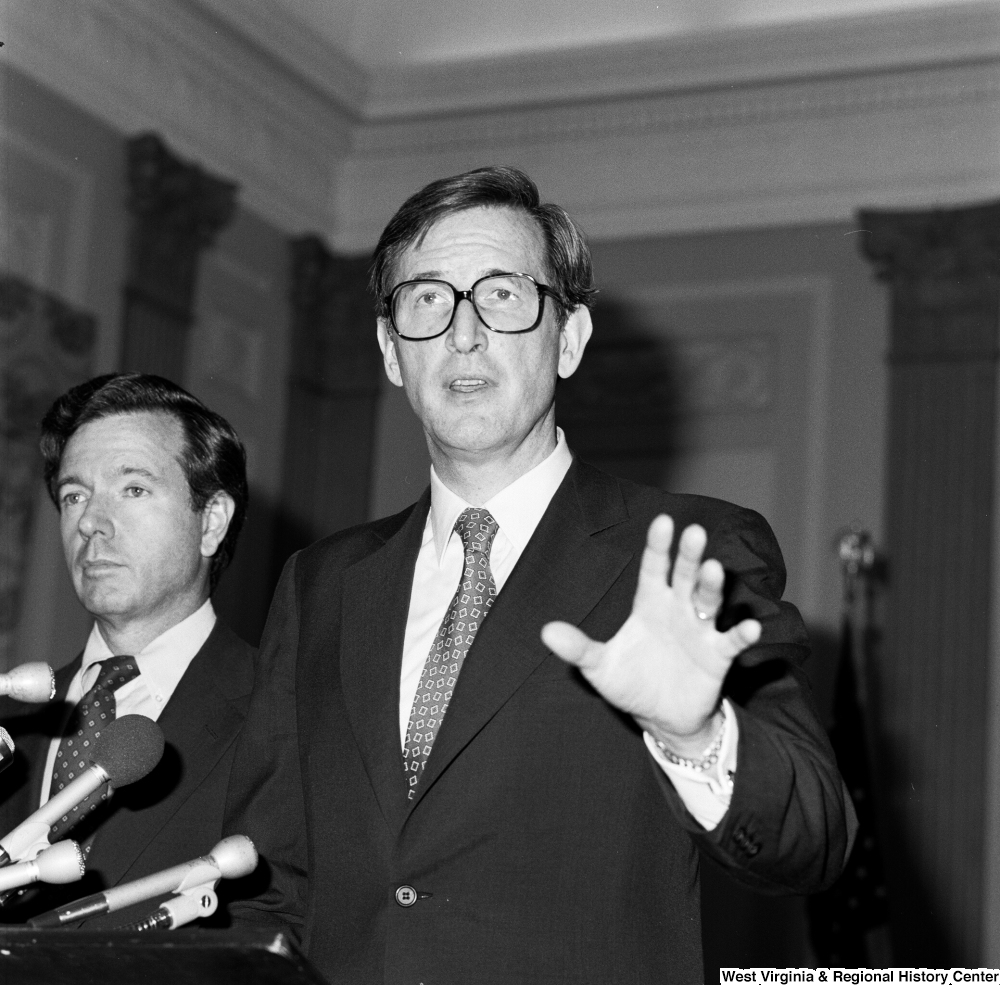 ["Senator John D. (Jay) Rockefeller outstretches an arm as he speaks to an audience about the Dislocated Workers Improvement Act that he has cosponsored with Senator John Heinz."]%