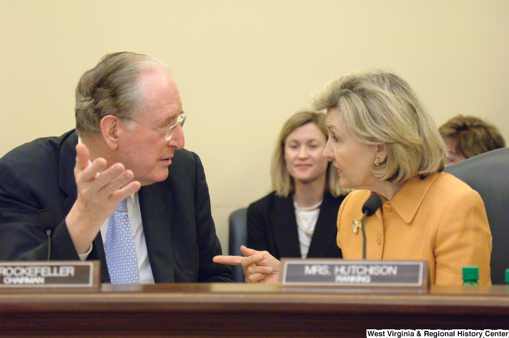 ["Senator John D. (Jay) Rockefeller and Kay Hutchison speak during a Commerce Committee hearing."]%