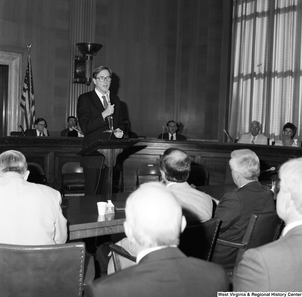 ["Senator John D. (Jay) Rockefeller speaks to the audience at a Senate committee hearing."]%