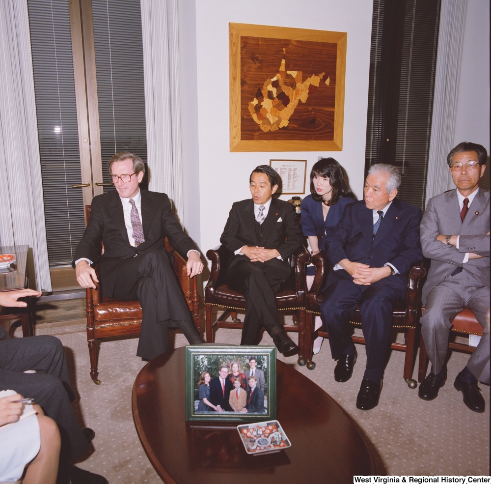 ["Senator John D. (Jay) Rockefeller sits in his office with a delegation from the Japanese Embassy."]%