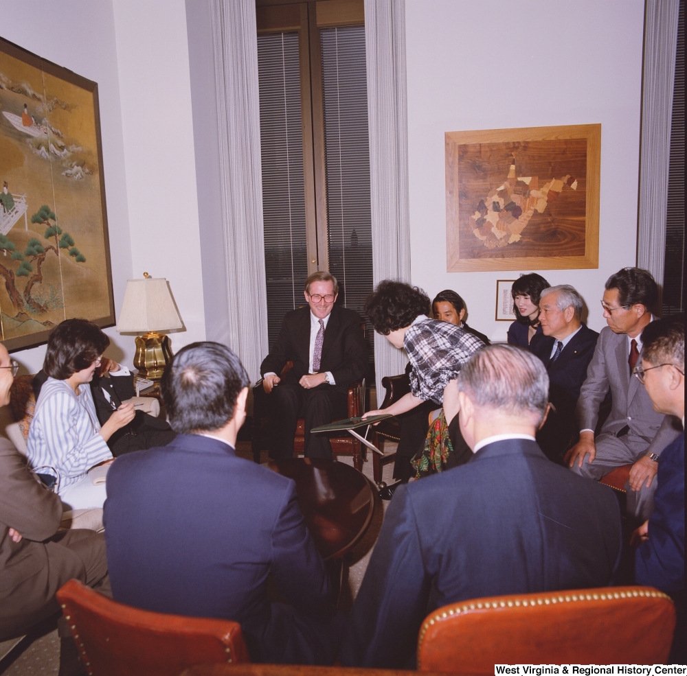 ["Senator John D. (Jay) Rockefeller sits with members of a delegation from the Japanese Embassy."]%