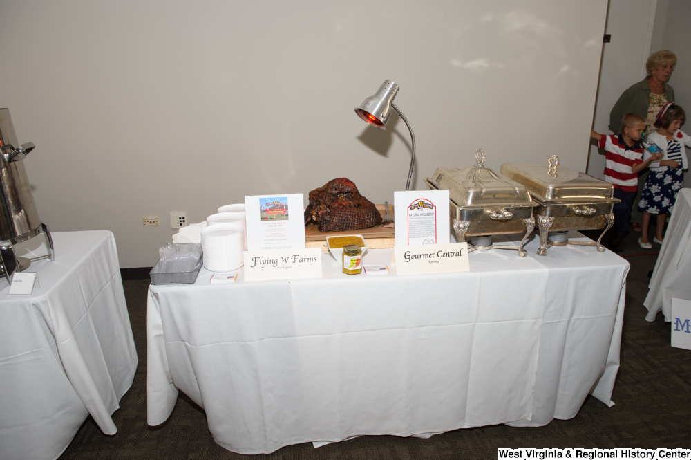 ["Flying W Farms displays some of their beef at the 150th birthday celebration for West Virginia."]%