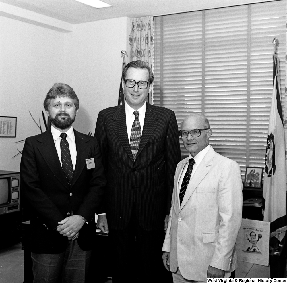 ["Senator John D. (Jay) Rockefeller poses for a photograph with Jack Frazier and Bernard Kern in his Washington office."]%