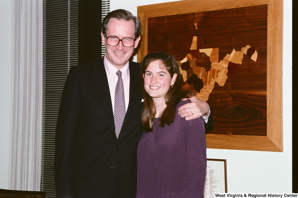 ["Senator John D. (Jay) Rockefeller hugs his daughter Valerie in his office."]%