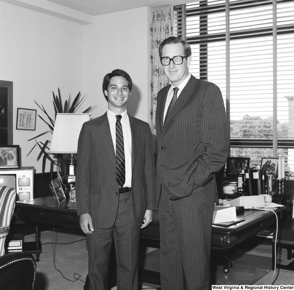 ["Senator John D. (Jay) Rockefeller stands in his Dirksen office for a photograph with an unidentified individual."]%