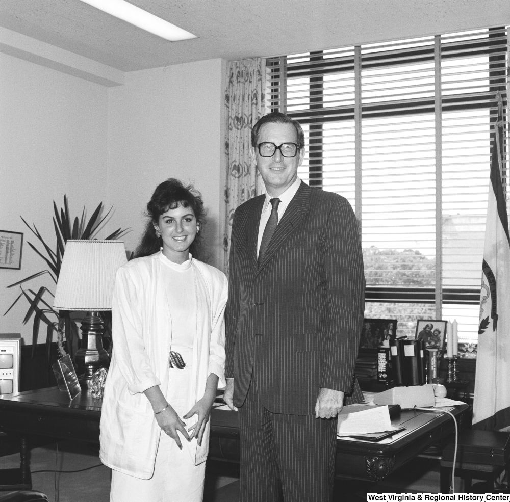 ["Senator John D. (Jay) Rockefeller stands for a photograph with an unidentified woman in his Dirksen office."]%