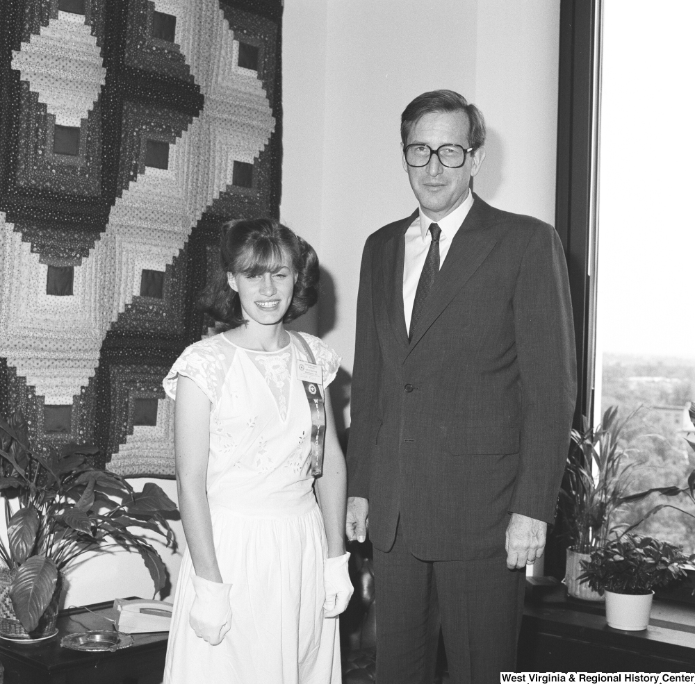 ["Senator John D. (Jay) Rockefeller stands next to one of the West Virginia participants in Girls Nation."]%