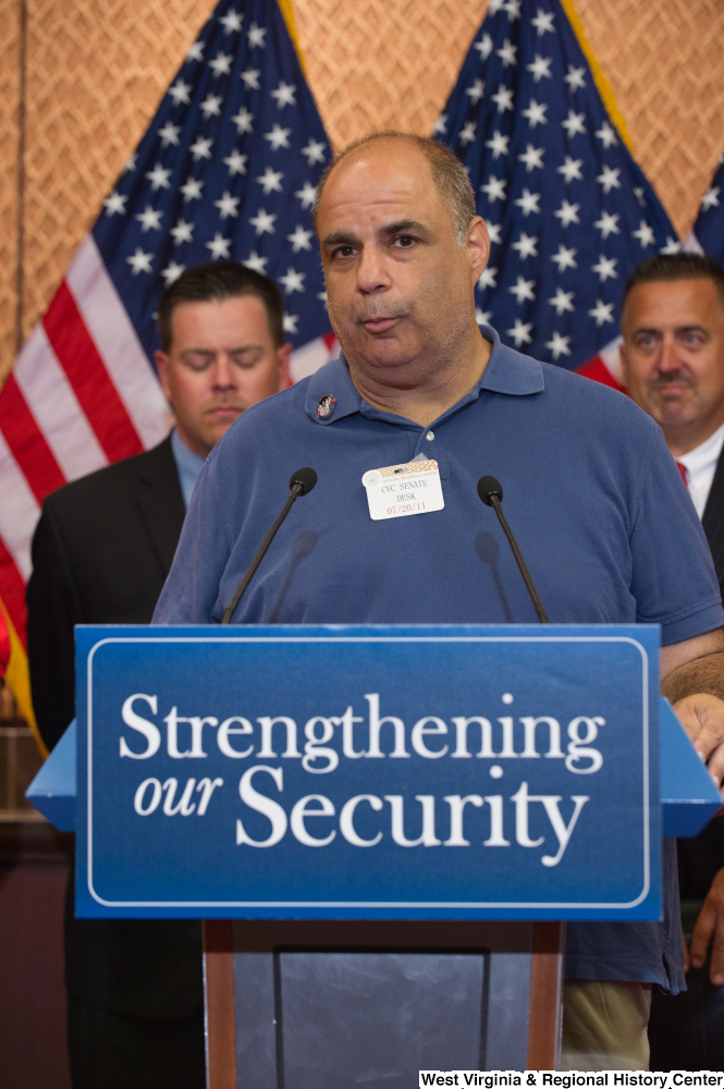 ["A visitor speaks at a Strengthening our Security press event."]%