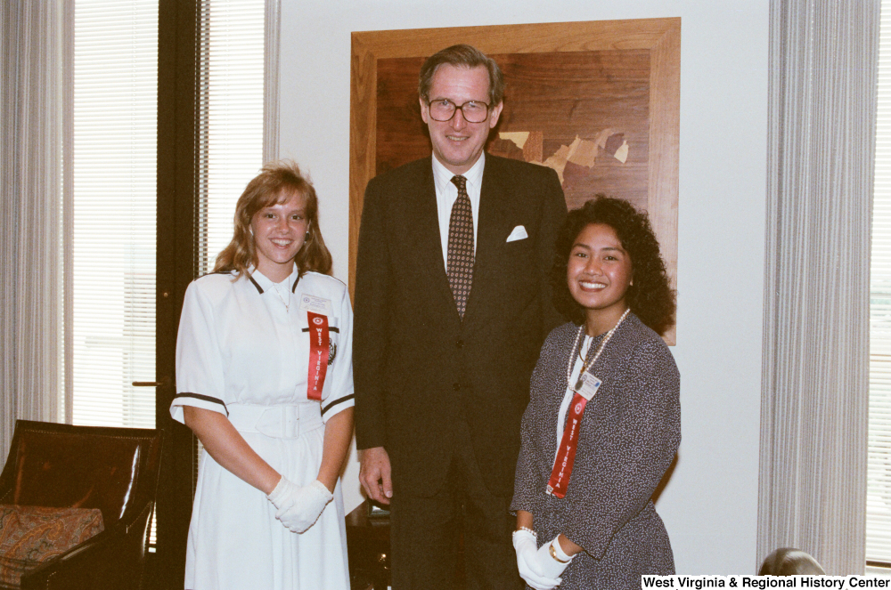 ["Senator John D. (Jay) Rockefeller stands with two Girls Nation participants."]%