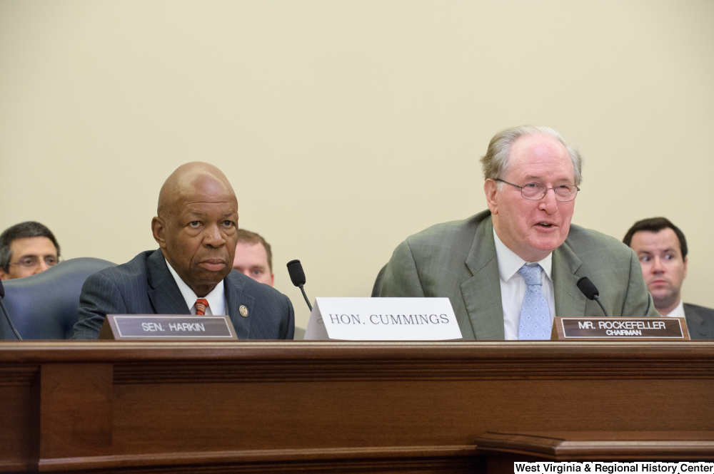 ["Senator John D. (Jay) Rockefeller and Representative Elijah Cummings sit next to each other at a Senate Commerce Committee hearing."]%
