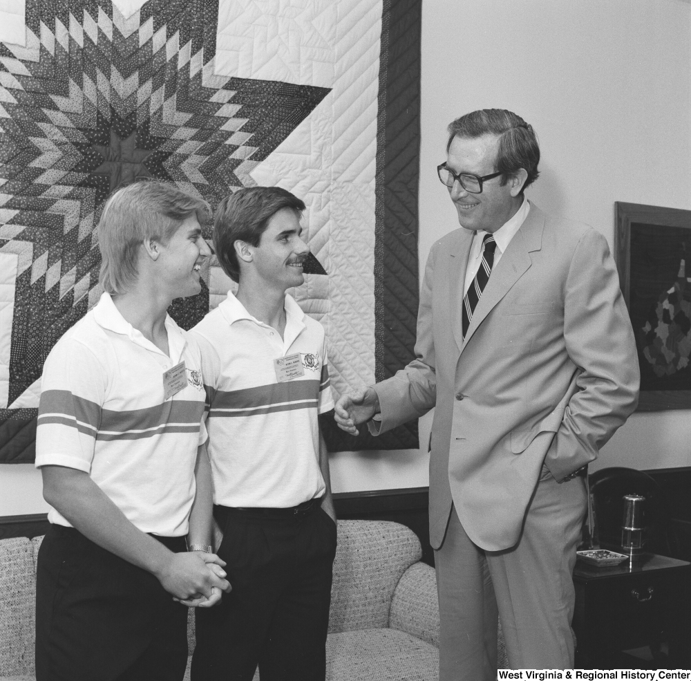 ["Senator John D. (Jay) Rockefeller speaks with two Boys Nation participants from West Virginia. Boys Nation is a civic and political simulation for top high school boys from each state and is run annually by the American Legion."]%
