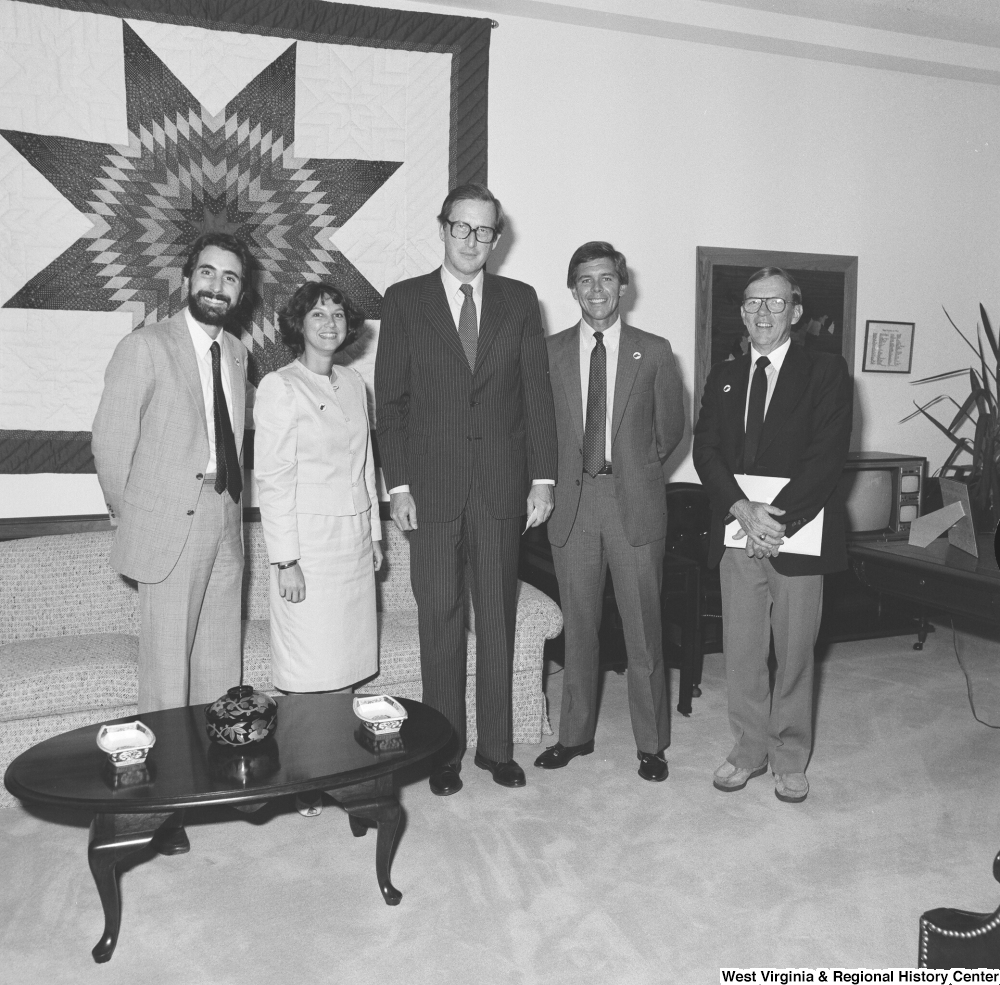 ["Senator John D. (Jay) Rockefeller stands for a photograph with an unidentified group in his Washington office."]%