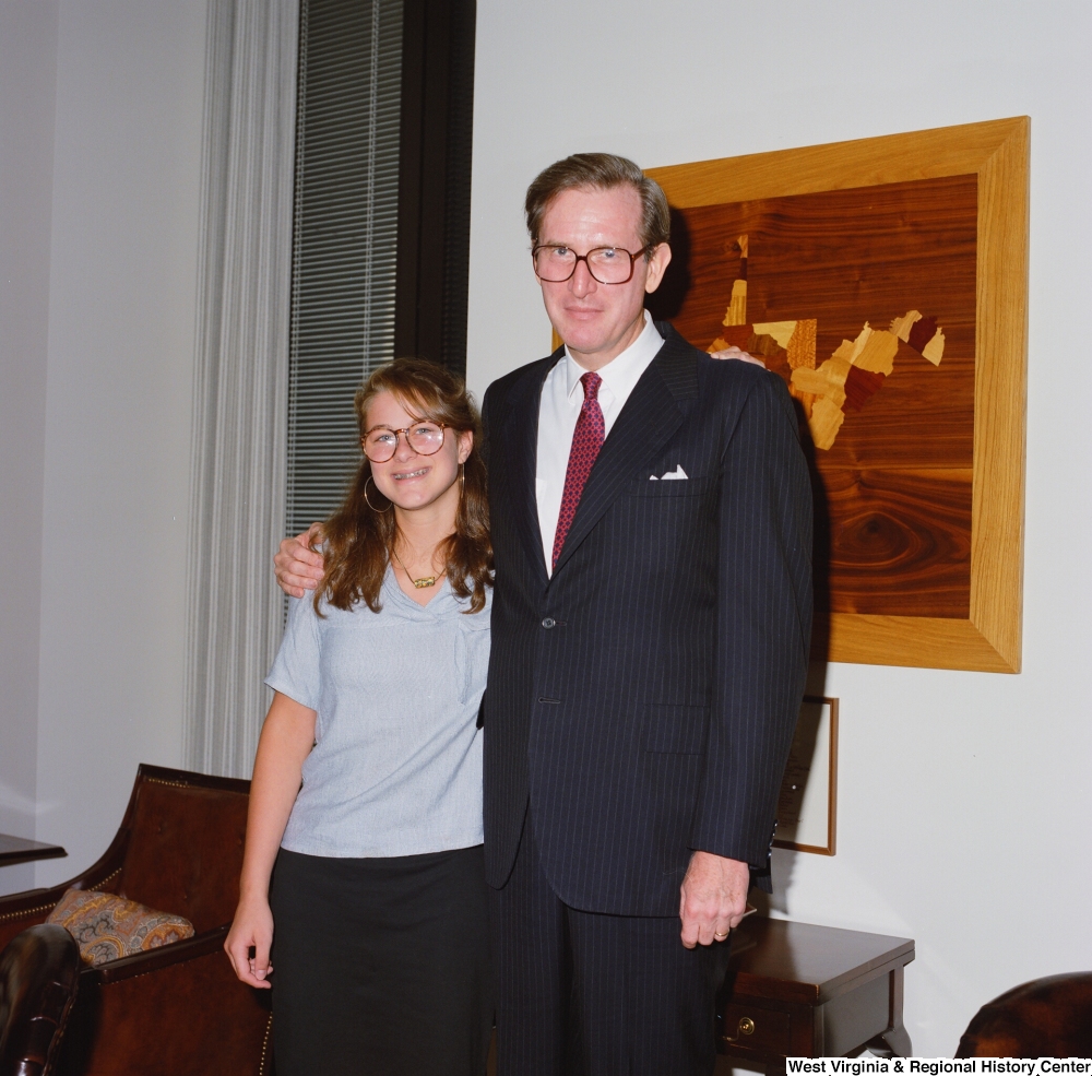 ["Senator John D. (Jay) Rockefeller with an unidentified young woman in his office."]%