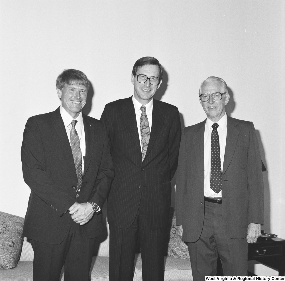 ["Senator John D. (Jay) Rockefeller stands between two NASA scientists."]%