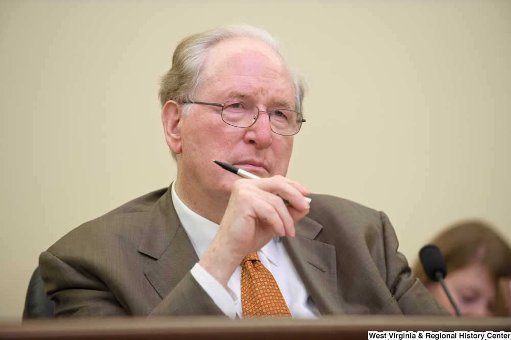 ["Senator John D. (Jay) Rockefeller holds a pen at a September 2012 Commerce Committee hearing."]%