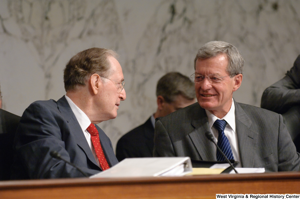 ["Senators John D. (Jay) Rockefeller and Max Baucus chat during an executive session to consider new health care reform legislation."]%