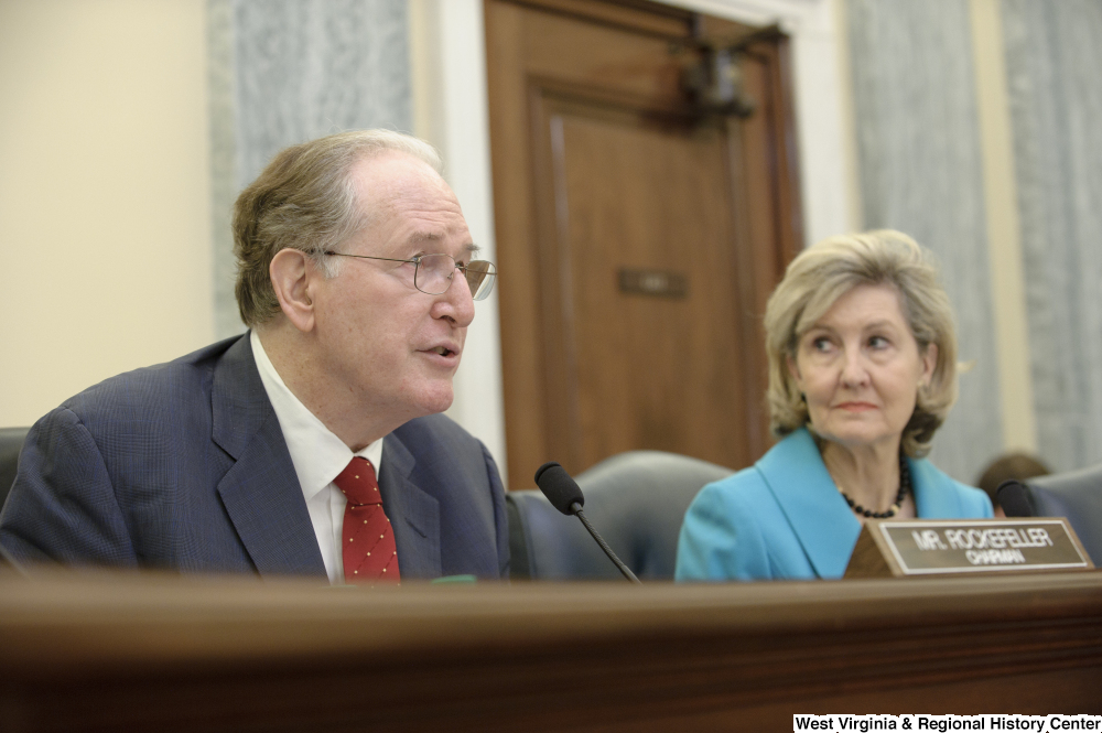 ["Senators John D. (Jay) Rockefeller and Kay Hutchison sit at a Commerce Committee hearing."]%