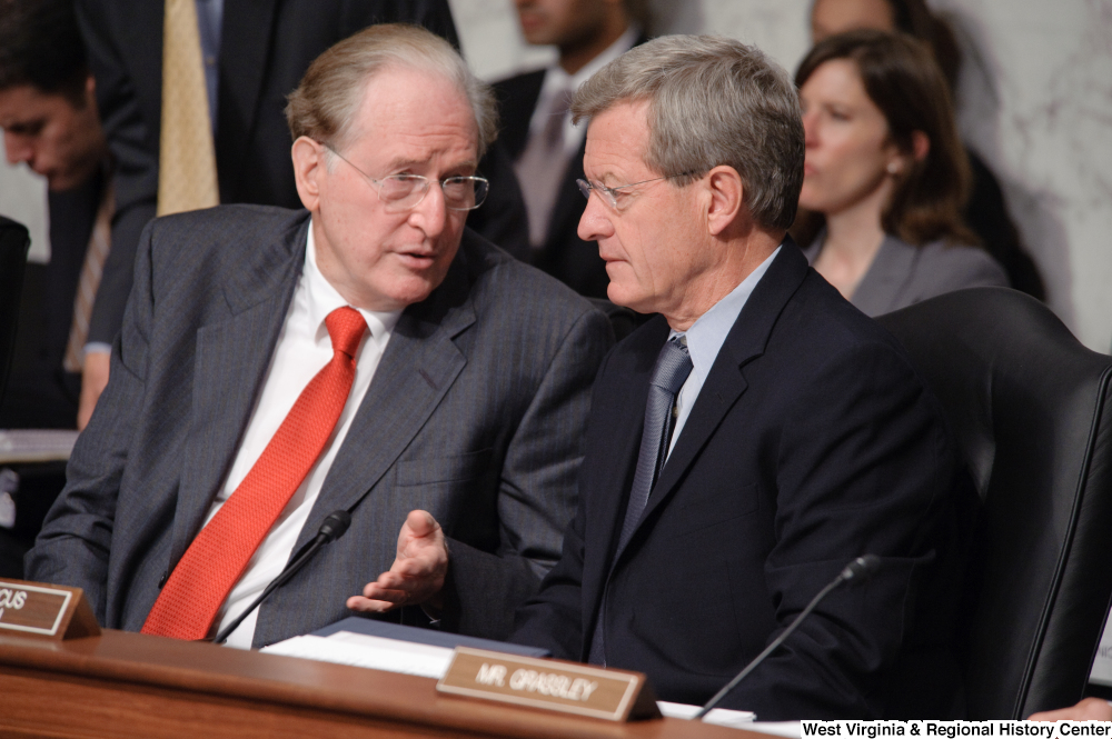 ["Senator John D. (Jay) Rockefeller and Senator Max Baucus chat during an executive session of the Finance Committee to consider health care reform legislation."]%