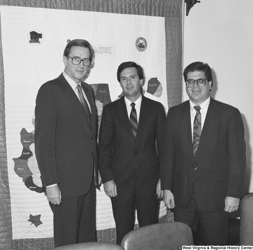 ["Senator John D. (Jay) Rockefeller stands next to two representatives of the Independent Oil and Gas Association of West Virginia."]%