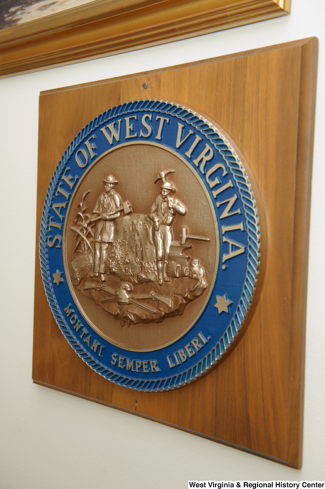 ["The state seal of West Virginia hangs on a wall in Senator John D. (Jay) Rockefeller's office."]%