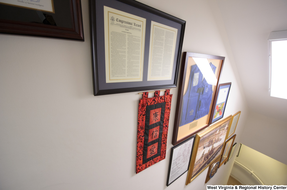 ["This photo shows items hanging in the stairwell of Senator Rockefeller's office."]%