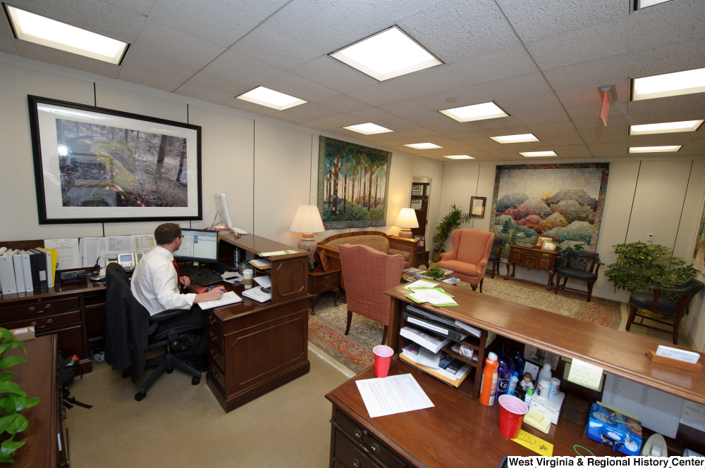 ["A staffer works at a reception desk in Senator John D. (Jay) Rockefeller's office."]%