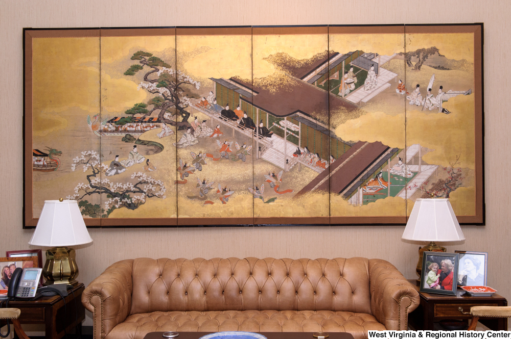 ["A large Japanese panel painting hangs in the sitting space of Senator Rockefeller's personal office."]%