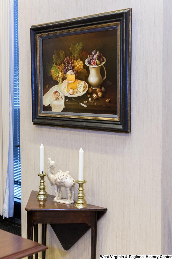 ["A still life painting and a small table sit in Senator Rockefeller's office."]%