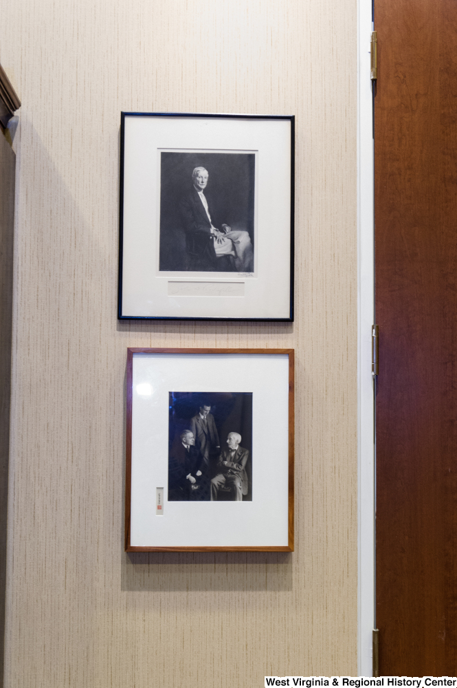 ["Two photographs of Senator John D. (Jay) Rockefeller's older male relatives hang on the wall in his office."]%