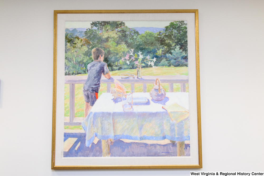 ["A painting of a young boy standing outside on a porch hangs in Senator John D. (Jay) Rockefeller's office."]%