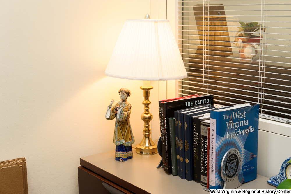 ["This photo shows some books sitting in a corner of Senator Rockefeller's office."]%
